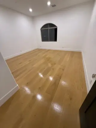 Room with shiny floors after move-out cleaning